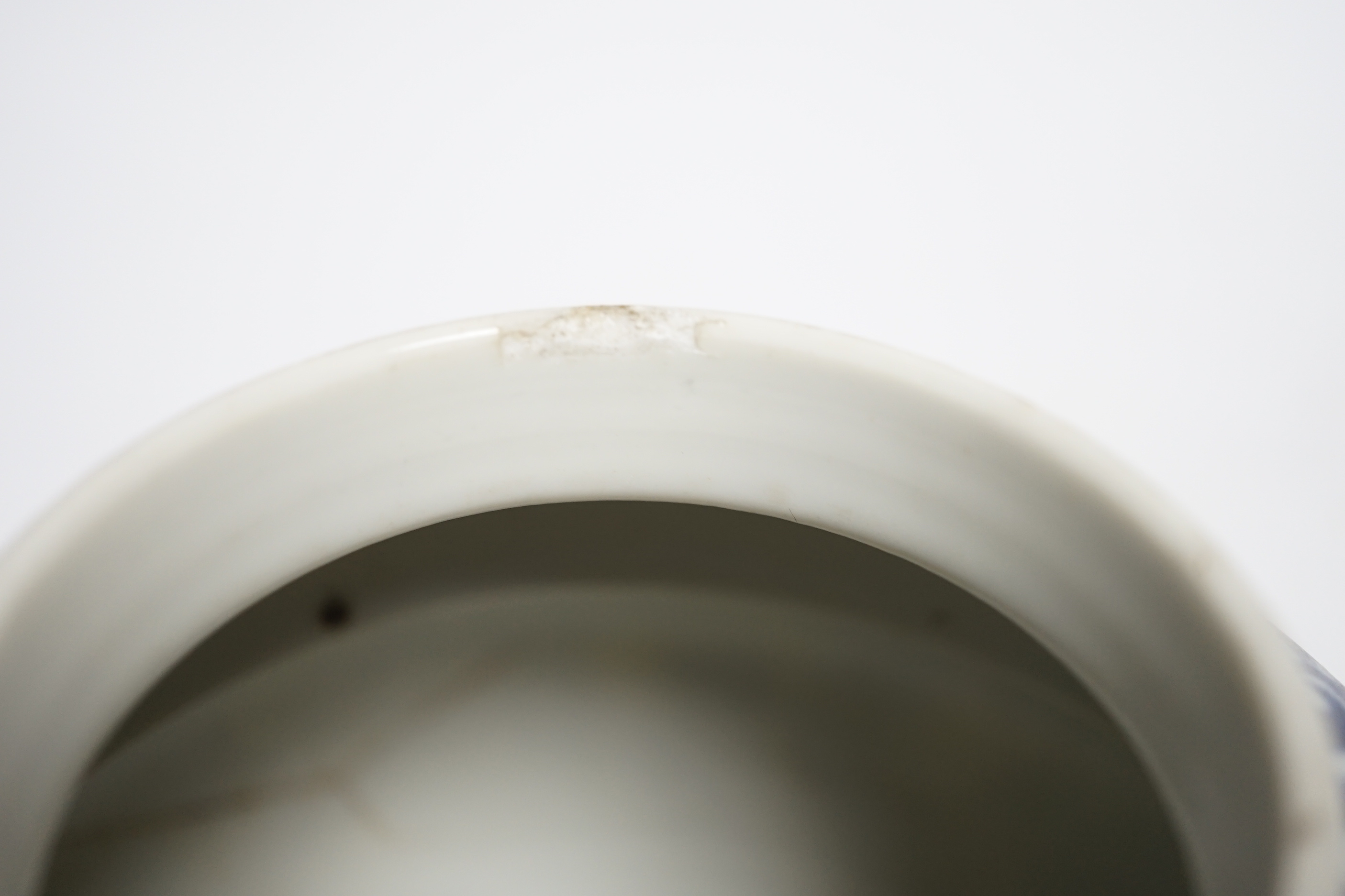 A late 19th century Chinese blue and white floral jar and cover, seal mark, 17cm high